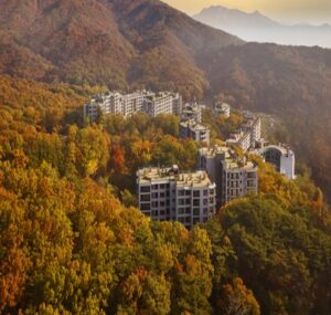 Panoramic autumn view of Mount Bukhansan and colorful fall foliage from the rooftop outdoor terrace of ANTO Resort Seoul