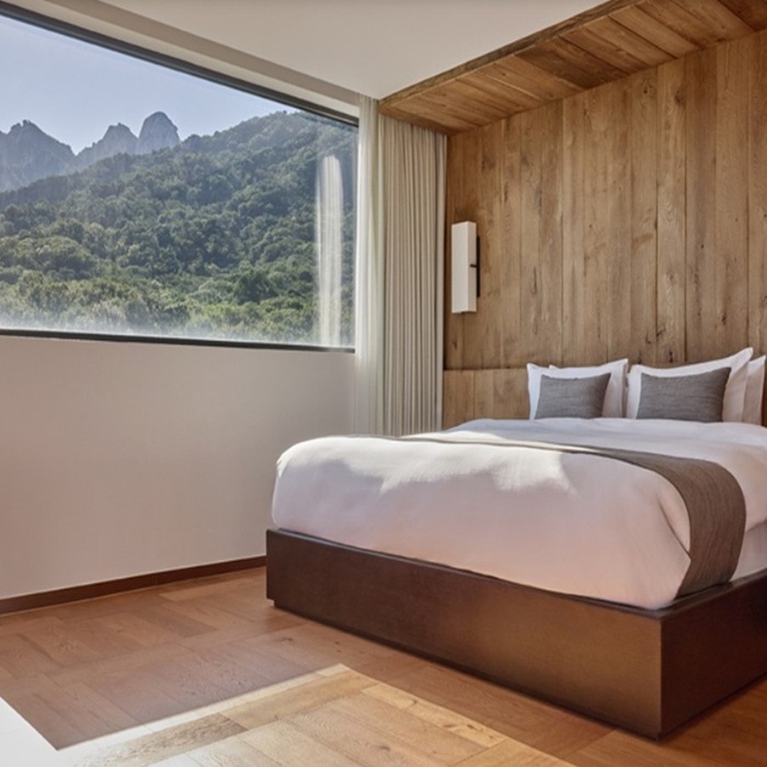 Luxury Timber Suite bedroom at ANTO Resort Seoul overlooking Bukhansan granite mountain peaks