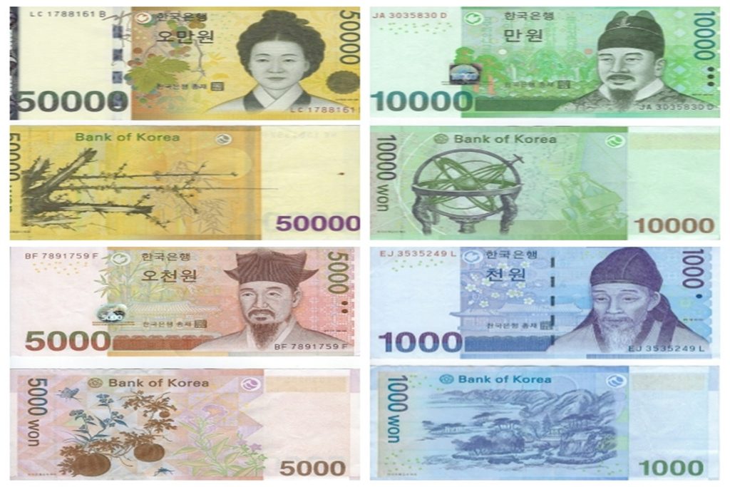 South Korean Won banknotes in denominations of 50000, 10000, 5000, and 1000 KRW cash used for reloading transit cards in Seoul