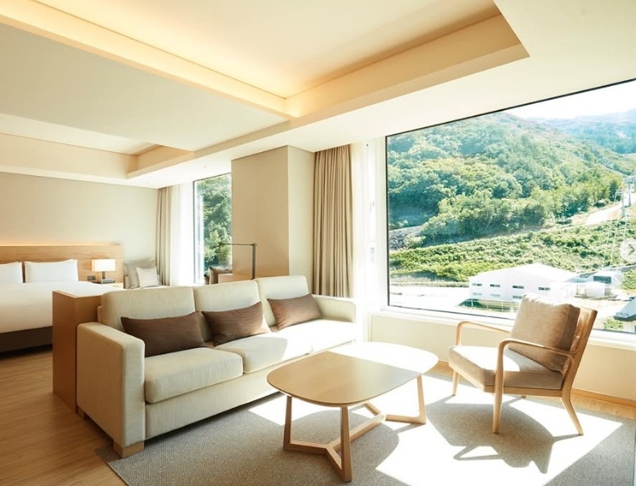 Panoramic mountain view and living area from luxury guestroom at Park Roche Resort