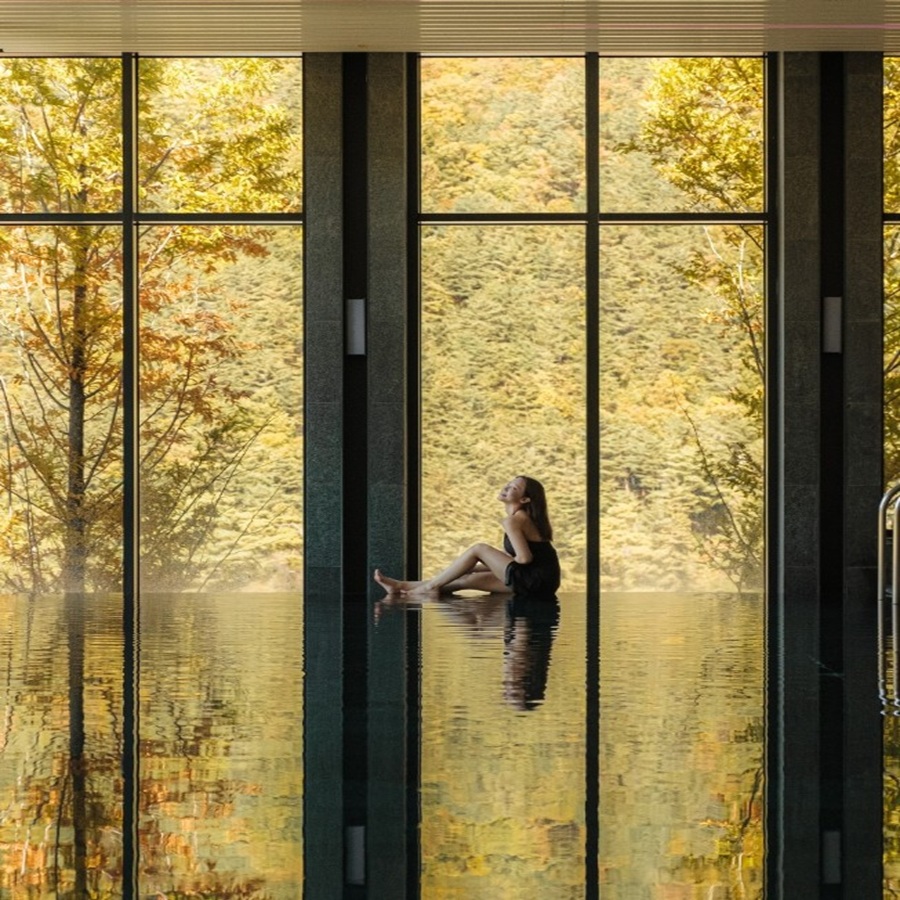 Serene indoor wellness spa overlooking autumn foliage reflection at Park Roche Resort