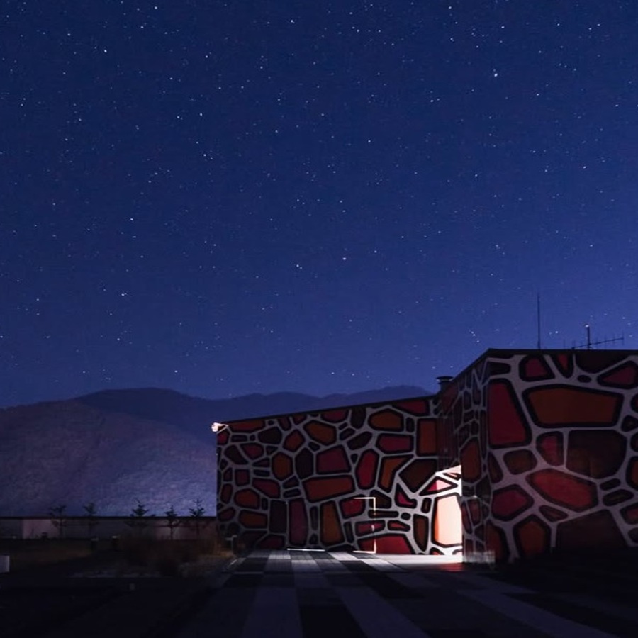 Open-air rooftop observatory at Park Roche Resort under clear starry night sky in Jeongseon