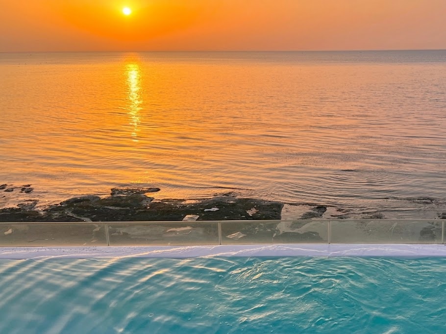 Relaxing private jet spa tub facing the horizon and blue ocean waves at Pohang March Blue Pool Villa