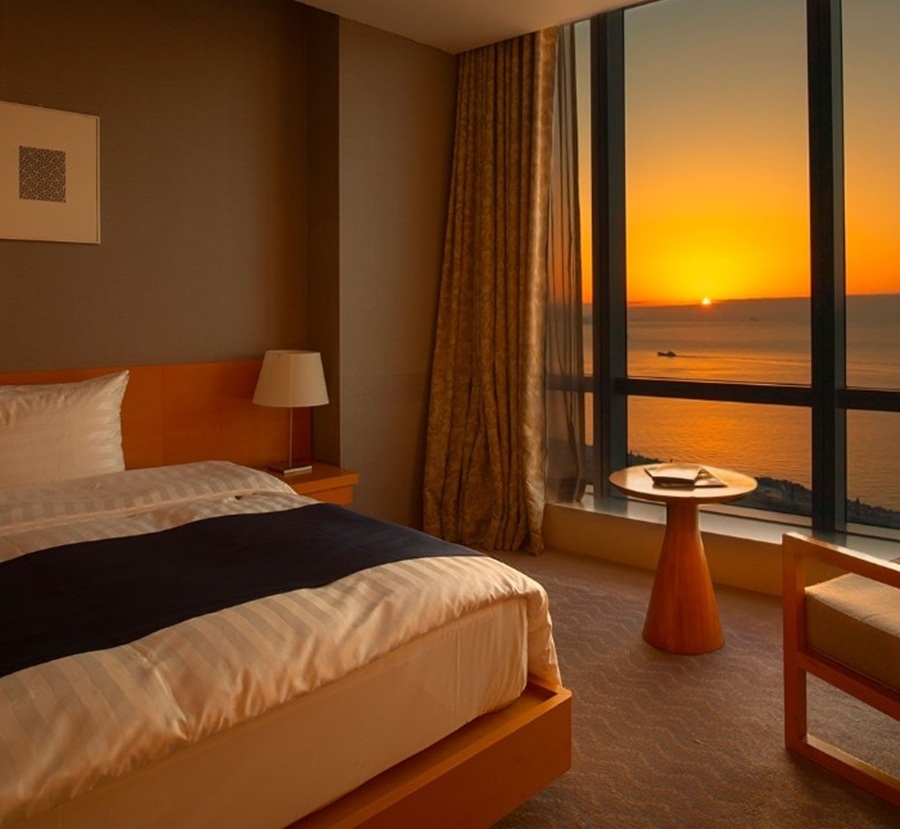 Panoramic ocean view from the guestroom window at Sono Calm Yeosu
